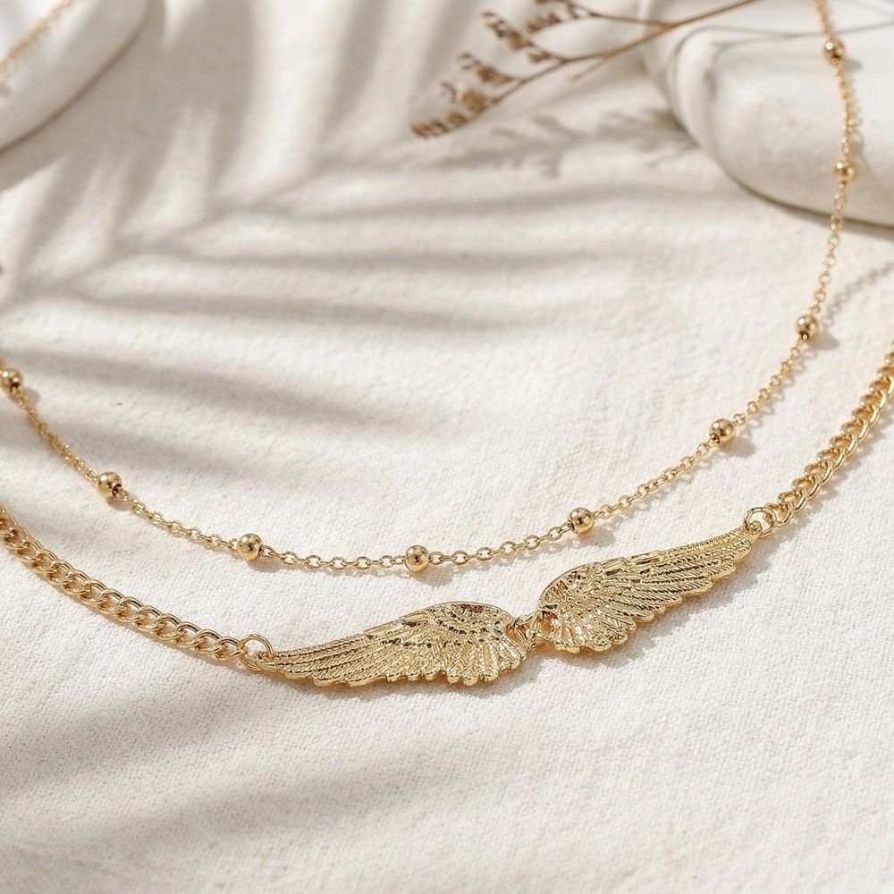 Elegante doppellagige Flügel-K – Body Jewelry For You Bewertung und Preis